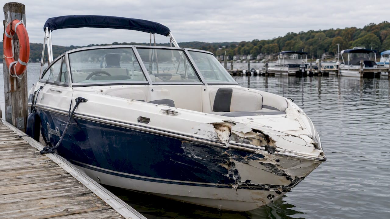 Damaged recreational boat secured at a Pennsylvania dock
